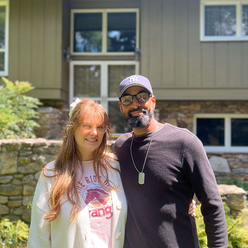 Volunteer and client together outdoors