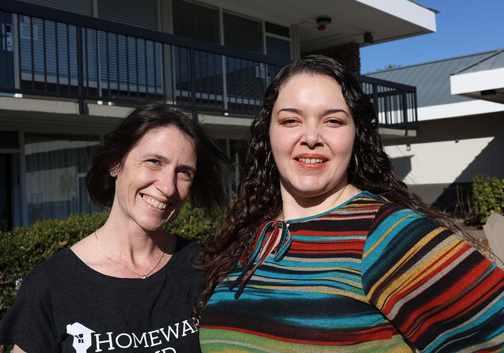 Client with Volunteer outside permanent housing solution