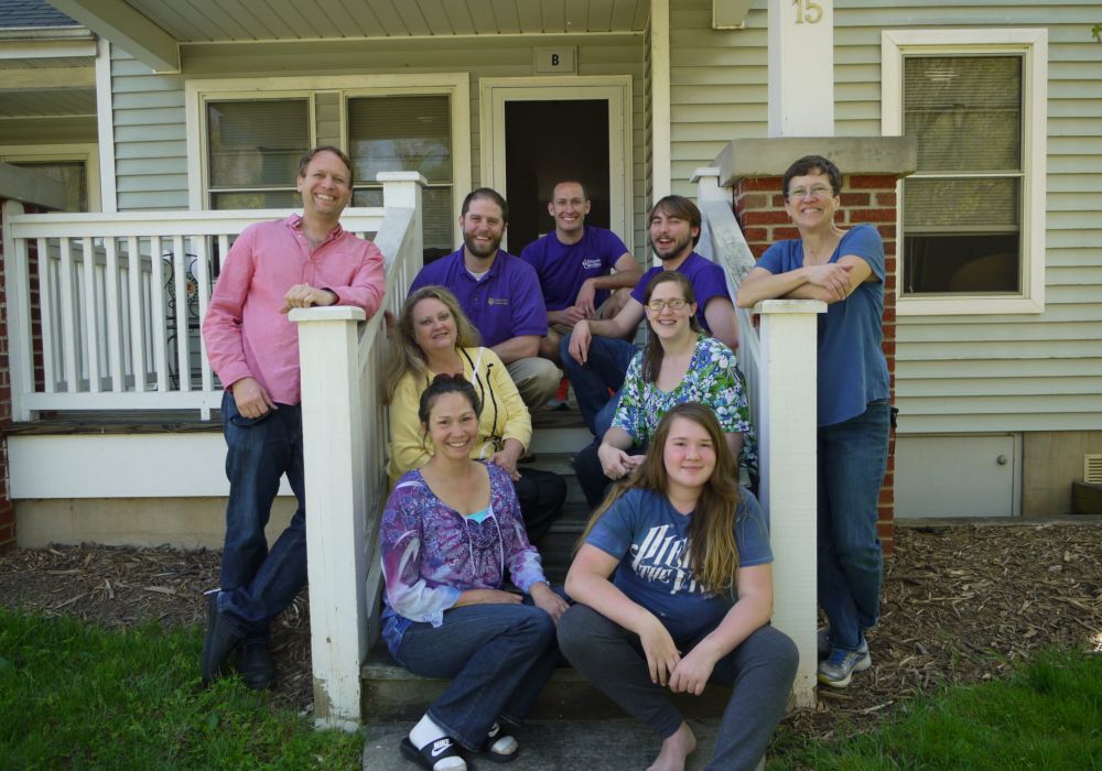 Volunteers standing in pickup/dropoff truck for the Homeward Bound WNC Welcome Center